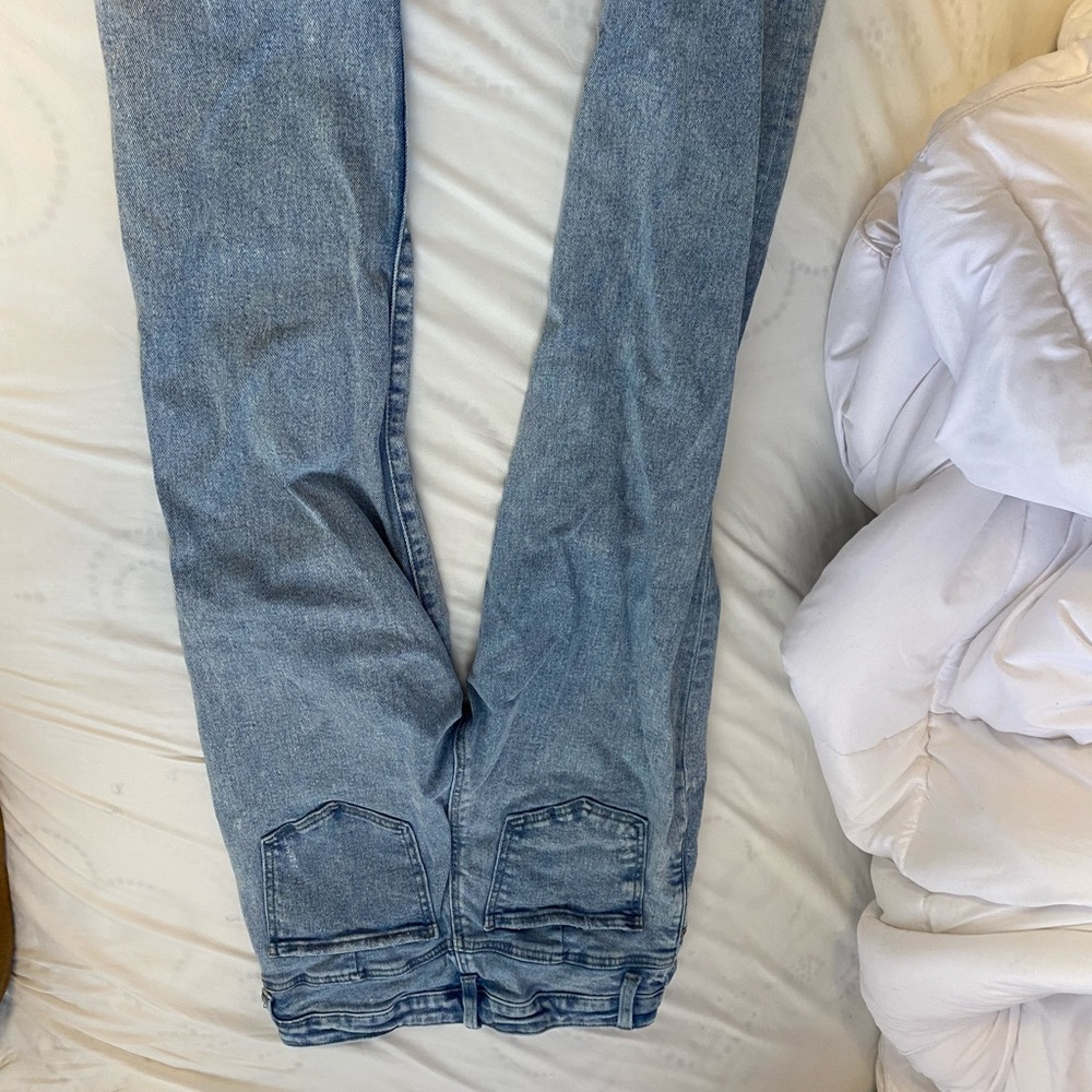 Blue mom jeans with minor rips in the knee girls 12-15